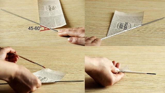 Ξεκινήστε να τυλίγετε λωρίδες εφημερίδων σε ένα σουβλάκι και έτσι ώστε ο σωλήνας να μην ξεδιπλώνεται, λιπάνετε το άκρο με κόλλα